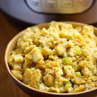 Instant Pot Cornbread Stuffing is the perfect Thanksgiving side dish. Fluffy cornbread flavored with sage and butter, and cooked in your electric pressure cooker. simplyhappyfoodie.com #instantpotrecipes #instantpotcornbread #instantpotcornbreadstuffing #instantpotcornbreaddressing #instantpotthanksgivingsidedish