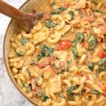 Instant Pot Creamy Garlic Tuscan Chicken Pasta is a one pot wonder! A rich and fabulous blend of flavors in a creamy sauce. Tender chicken makes this a complete meal made in your electric pressure cooker! simplyhappyfoodie.com #instantpotrecipes #instantpotpasta #instantpotchickenpasta #instantpottuscanchicken #instantpotmacandcheese