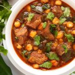 Instant Pot Posole - Pork Stew is Posole with a few extras. Poblano chile peppers and chipotle make this a spicy one pot meal. ¡Es muy deliciosa! simplyhappyfoodie.com #instantpotrecipes #instantpotposole #instantpotpozole #instantpotporkstew #pressurecookerrecipes