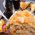 Instant Pot Beef Guinness Stew in a bowl and on a spoon.