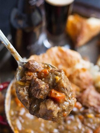 Instant Pot Beef Guinness Stew on a spoon.