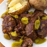 Instant Pot Mississippi Pot Roast is a classic pot roast made in the electric pressure cooker. With ranch, au jus, butter, and pepperoncinis for amazing, rich flavor. simplyhappyfoodie.com #instantpotrecipes #instantpotpotroast #instantpotmississippipotroast #mississippipotroast #pressurecookerpotroast