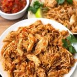 Instant Pot Salsa Chicken is Mexican flavored shredded chicken breast that you can use for tacos, burrito bowls, and casseroles. Lots of flavor, and this pressure cooker shredded chicken is so useful! simplyhappyfoodie.com #instantpotrecipes #instantpotsalsachicken #instantpotshreddedchicken #Instantpotchickenbreast #pressurecookerchicken