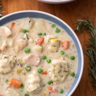 Instant Pot Chicken and Dumplings are a delicious comfort food you make in your electric pressure cooker. Choose your favorite type of dumpling and make this wonderful one-pot meal in about an hour! simplyhappyfoodie.com #instantpotrecipes #instantpotchickenanddumplings #pressurecookerrecipes #pressurecookerchickenanddumplings