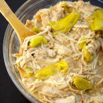 Mississippi Chicken in a glass bowl with wooden spoon