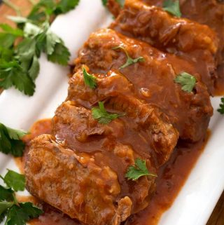 Instant Pot Saucy Beef Brisket is tender and flavorful. A cross between BBQ and sweet and sour, the sauce is tasty and plentiful for this pressure cooker brisket! simplyhappyfoodie.com #instantpotrecipes #instantpotbrisket #pressurecookerbrisket #instantpotbeefbrisket