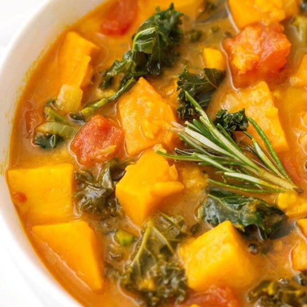 Close up of Sweet Potato Kale Soup in a white bowl