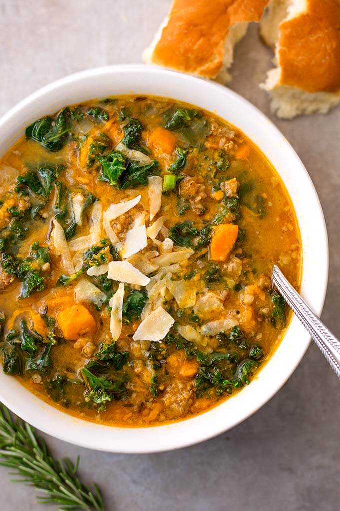 Instant Pot Sweet Potato Sausage and Kale Soup is a hearty, but not heavy soup with a ton of flavor. It is easy to make, and so very delicious, and even healthy! simplyhappyfoodie.com #instantpotrecipes #instantpotsweetpotatosausagekalesoup #instantpotsoup #pressurecookersoup
