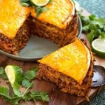 Instant Pot Taco Pie has layers of tortillas, beans, meat, and cheese. A great meal to make in your Electric pressure cooker. simplyhappyfoodie.com #instantpotrecipes #instantpottacopie #pressurecookertacopie #pressurecookerrecipes