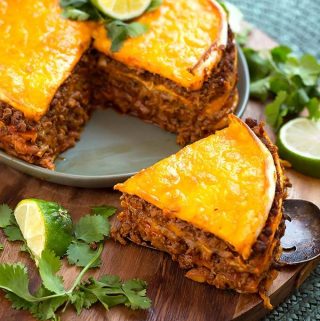 Instant Pot Taco Pie has layers of tortillas, beans, meat, and cheese. A great meal to make in your Electric pressure cooker. simplyhappyfoodie.com #instantpotrecipes #instantpottacopie #pressurecookertacopie #pressurecookerrecipes