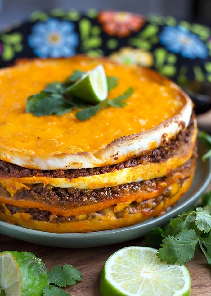 Instant Pot Taco Pie on a green plate with a lime wedge on top