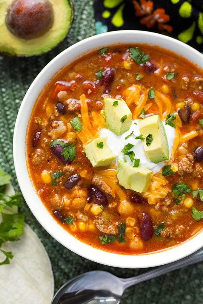 Instant Pot Taco Soup in white bowl on green mat