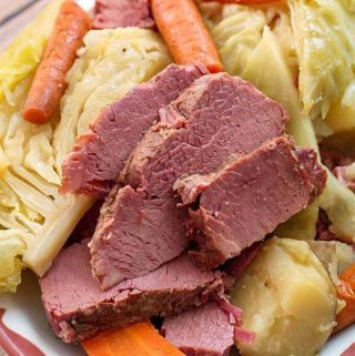Instant Pot Corned Beef Cabbage is absolutely delicious. Make this classic St. Patrick's Day Irish meal. Pressure cooker corned beef brisket and cabbage is a dump and start recipe! simplyhappyfoodie.com #instantpotrecipes #instantpotcornedbeefandcabbage #instantpotcornedbeef #instantpotbrisket #pressurecookerbrisket