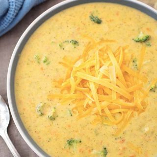 Instant Pot Broccoli Cheddar Soup is thick and cheesy with the right amount of broccoli. This pressure cooker broccoli cheddar soup is so delicious, you might need to make a double batch! simplyhappyfoodie.com #instantpotrecipes #instantpotsoup #instantpotbroccolicheddar #pressurecookerbroccolicheddarsoup