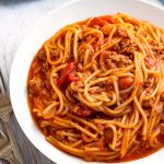 Instant Pot Spaghetti is a one pot spaghetti that turns out delicious, and is easy and quick to make. Pressure cooker spaghetti, who knew?! simplyhappyfoodie.com #instantpotrecipes #instantpotspaghetti #pressurecookerspaghetti