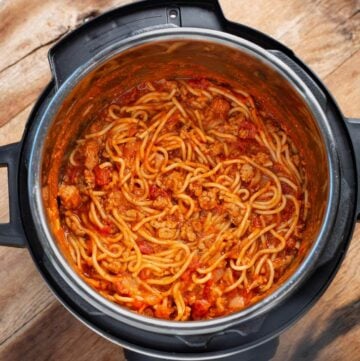 Instant Pot Spaghetti in pot with spoon.