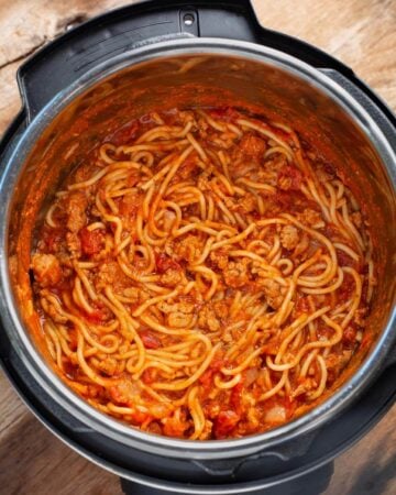 Instant Pot Spaghetti in pot with spoon.