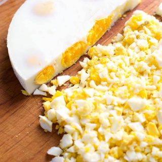 The Instant Pot Egg Loaf is a speedy and efficient way to hard cook several eggs at once, and not have to peel them! This recipe makes an egg “Loaf” that you can just chop up when it is done cooking! Making a pressure cooker egg loaf is so easy! simplyhappyfoodie.com #instantpotrecipes #instantpotboiledeggs #instantpothardcookedeggs #instantpoteggloaf #pressurecookereggs