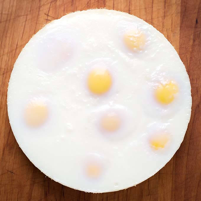 top view of whole egg loaf on a wooden board