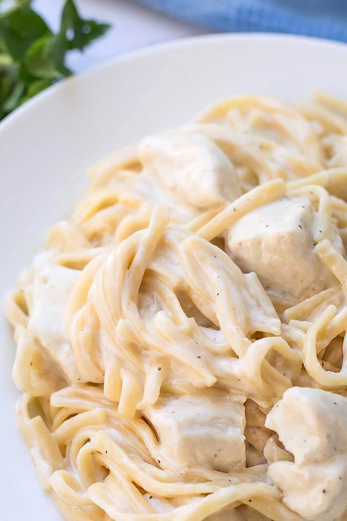 Instant Pot Fettuccine Alfredo with chicken on a white plate