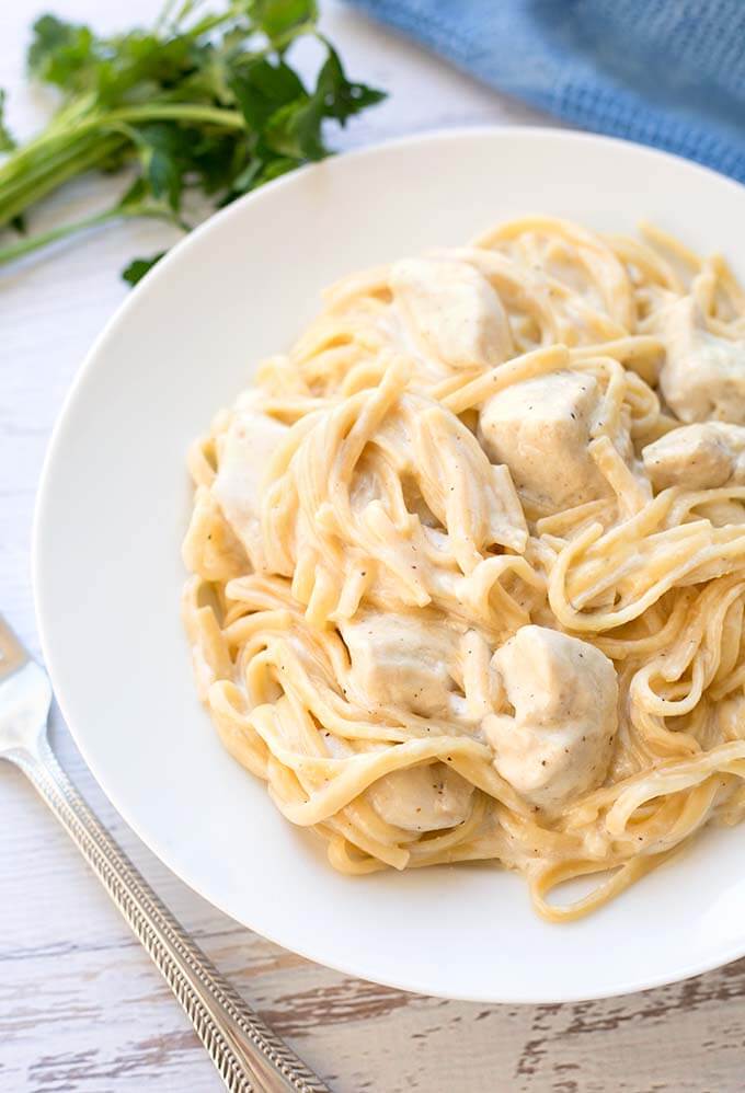 Instant Pot Fettuccine Alfredo with chicken on a white plate