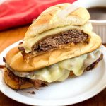 French Dip Sandwiches on a white plate