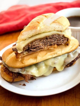 French Dip Sandwiches on a white plate