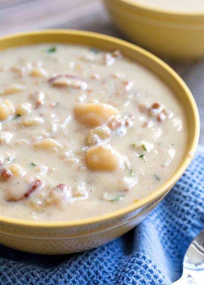 Instant Pot Simple Potato Soup is a creamy, savory potato soup recipe that is easy to make and tastes delicious. Pressure Cooker potato soup is comforting and simply tasty. simplyhappyfoodie.com #instantpotrecipes #instantpotpotatosoup #instantpotsoup #pressurecookerpotatosoup