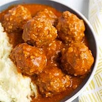 Instant Pot Porcupine Meatballs with mashed potatoes in a black bowl