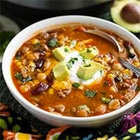 Instant Pot Taco Soup in a white bowl with a spoon