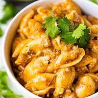 Instant Pot Cheesy Taco Pasta in a white bowl