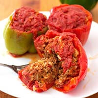 Three Instant Pot Stuffed Peppers on a white plate