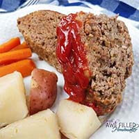 Instant Pot Meat Loaf with potatoes and carrots on a white plate