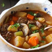 Old Fashioned Beef Vegetable Soup in a beige bowl