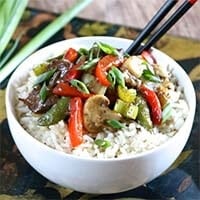 Instant Pot Chop Suey over rice in a white bowl