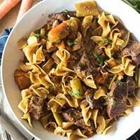 Instant Pot Beef Stew Pasta in a white bowl