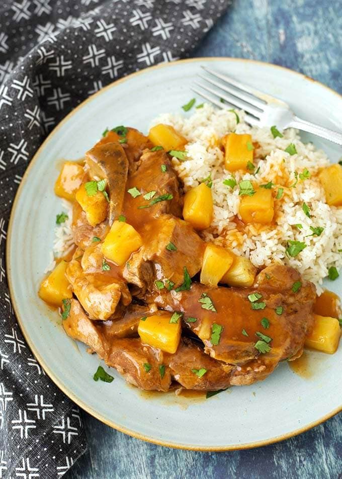 Sweet and Sour Country Ribs with rice on a gray-blue plate