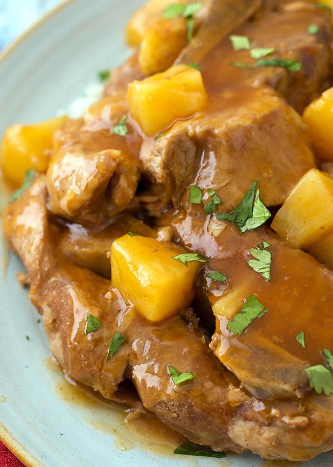 Closeup of Sweet and Sour Country Ribs on a bluish-gray plate