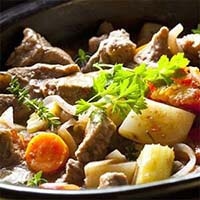 Leftover Beef Stew in a dark colored bowl