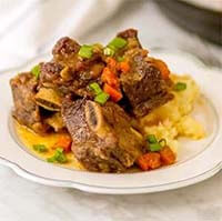 Incredibly Tender Instant Pot Short Ribs on a white plate