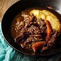 Red Wine Beef Stew in a black bowl