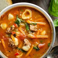 Pressure Cooker Hamburger Pasta Soup in a gray bowl