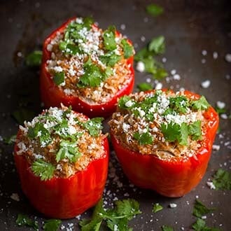 Three Mexican Stuffed Peppers on a black platter