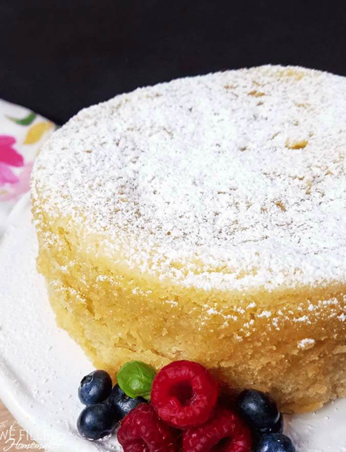 Grandmas pound cake on a white plate with berries
