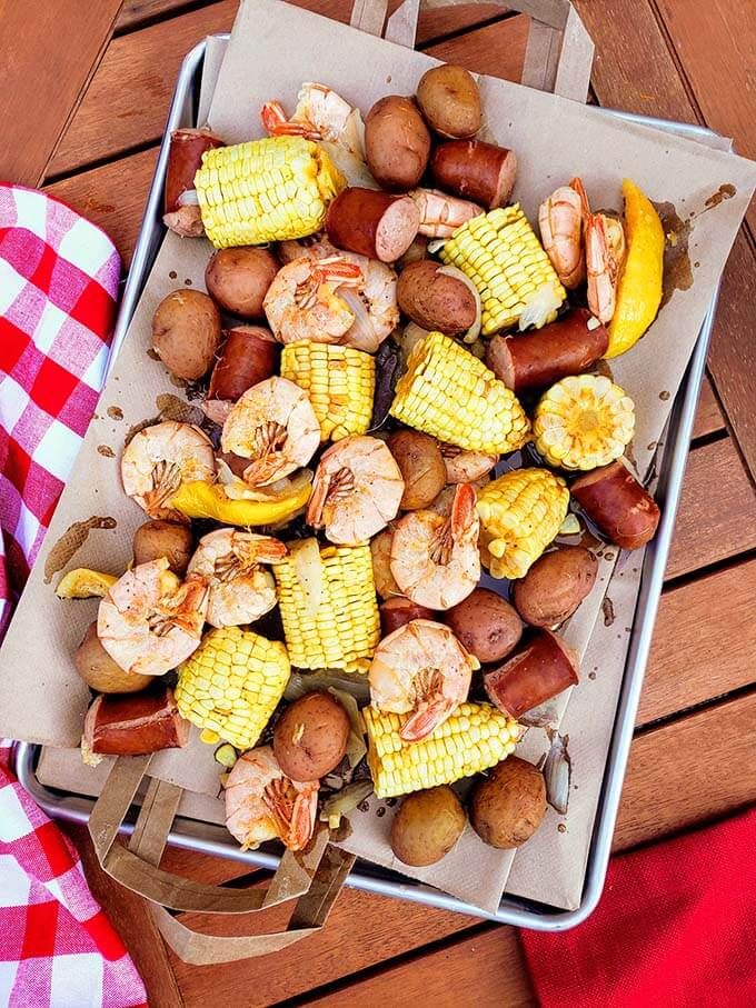 Shrimp Boil on paper napkins on a baking sheet