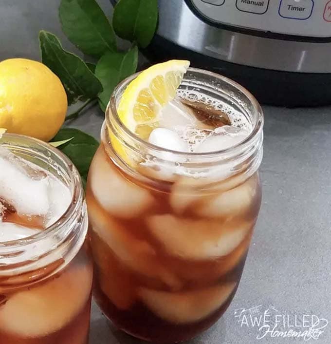 two mason jars of sweet tea with lemon slices