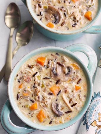 Top view of Wild Rice Soup with Chicken in a blue bowl