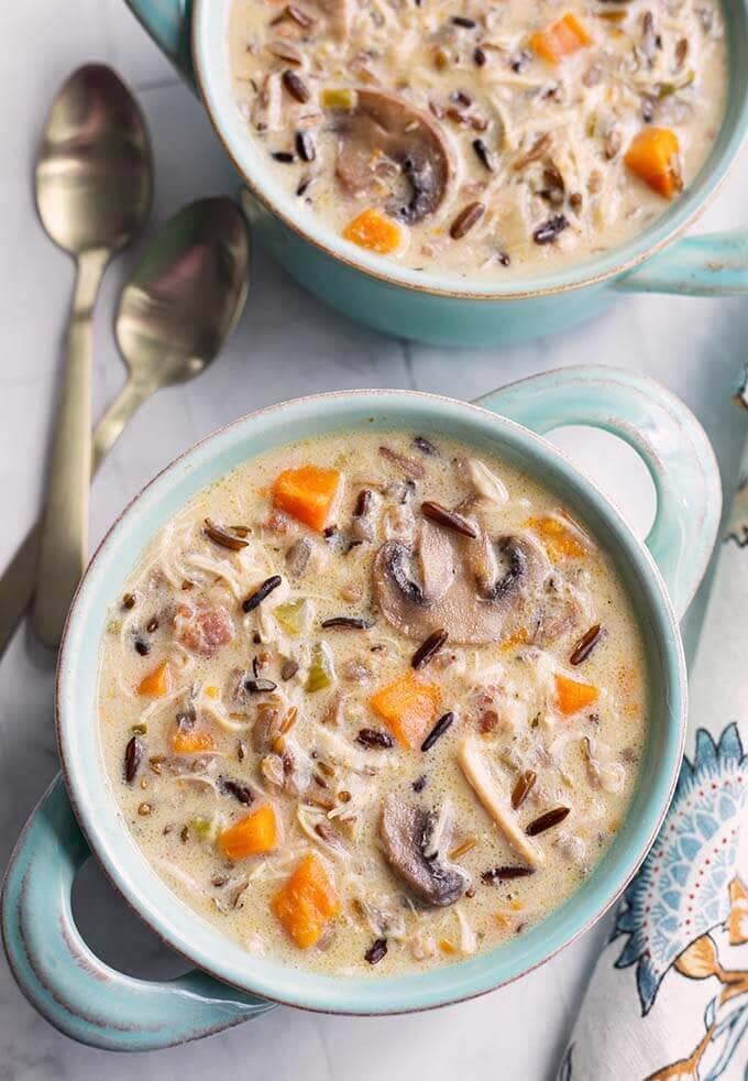 Top view of Wild Rice Soup with Chicken in a blue bowl