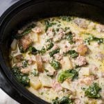 Zuppa Toscana Sausage Potato Soup in a black slow cooker