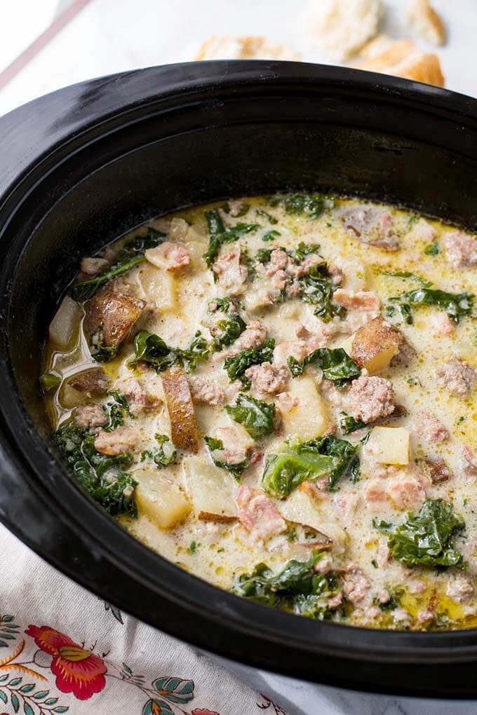 Zuppa Toscana Sausage Potato Soup in a black slow cooker